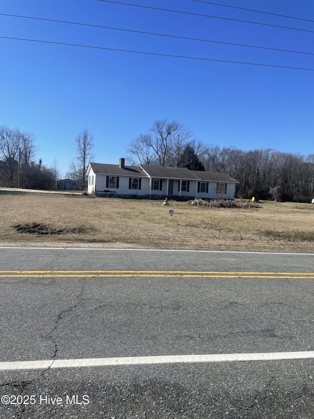 view of front of home with a front lawn