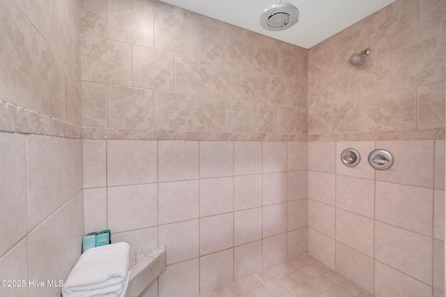 full bath featuring tiled shower