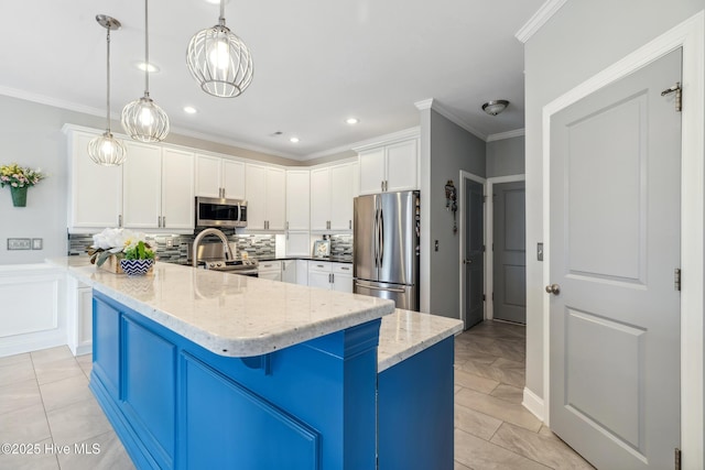 kitchen with light stone countertops, stainless steel appliances, white cabinets, crown molding, and backsplash