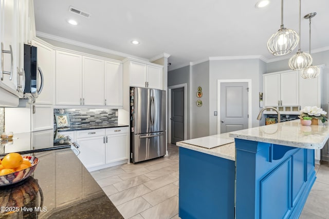 kitchen with visible vents, decorative backsplash, dark stone countertops, appliances with stainless steel finishes, and white cabinetry