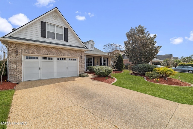 view of front of home with a front lawn, a garage, and driveway