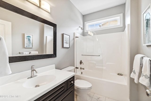 bathroom with toilet, marble finish floor, vanity, and shower / tub combination