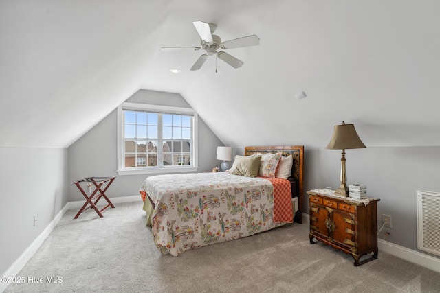 bedroom with visible vents, a ceiling fan, carpet, and vaulted ceiling