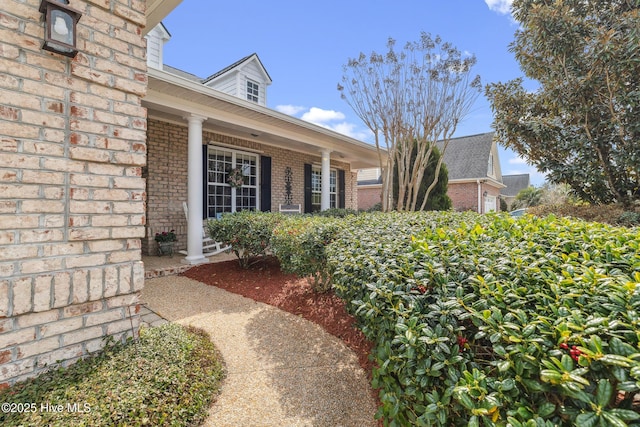 entrance to property with brick siding