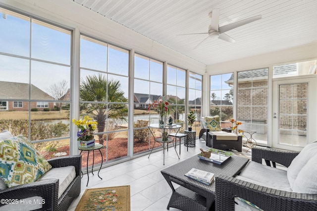 sunroom featuring ceiling fan