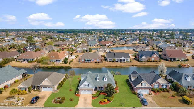 aerial view with a residential view and a water view