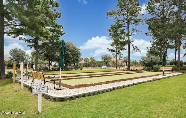 view of home's community featuring a lawn