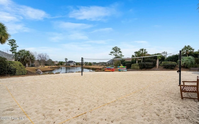 view of community featuring volleyball court and a water view