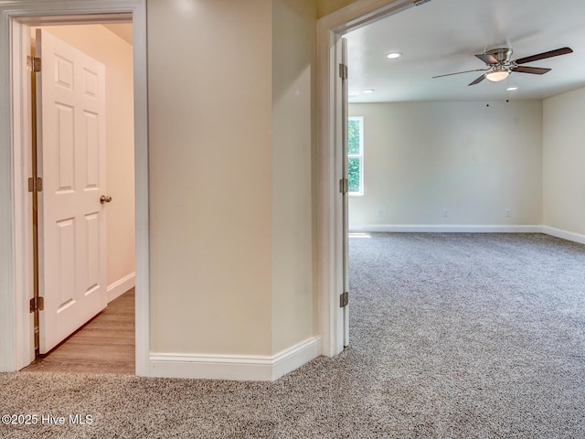 corridor featuring recessed lighting, baseboards, and carpet floors