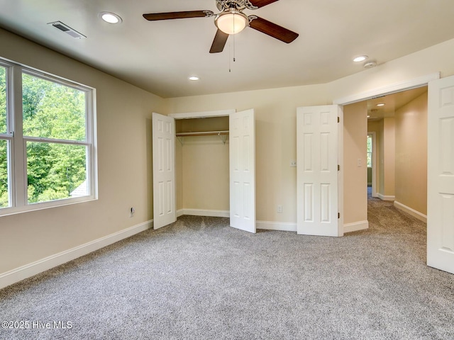 unfurnished bedroom with carpet, visible vents, baseboards, recessed lighting, and a closet