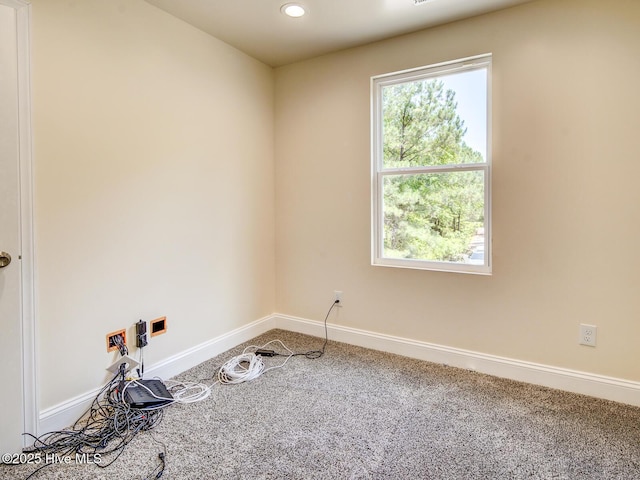 carpeted empty room with recessed lighting and baseboards