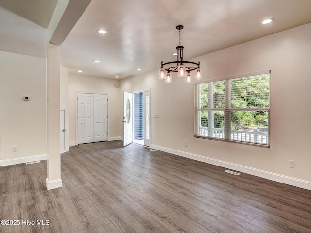 interior space featuring recessed lighting, visible vents, baseboards, and dark wood-type flooring