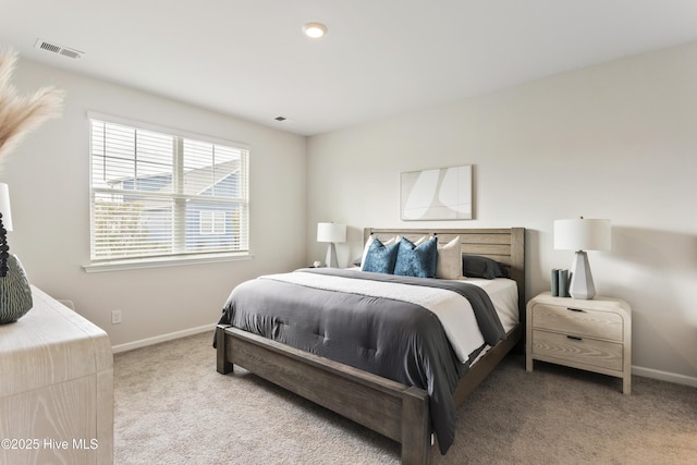 bedroom featuring carpet, visible vents, and baseboards