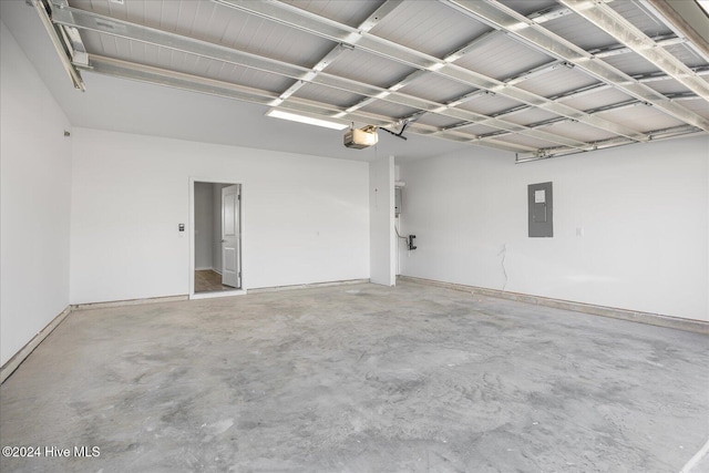 garage with electric panel and a garage door opener