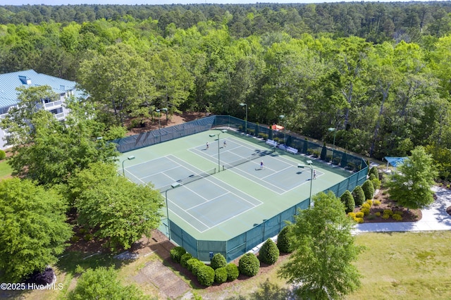 drone / aerial view with a wooded view