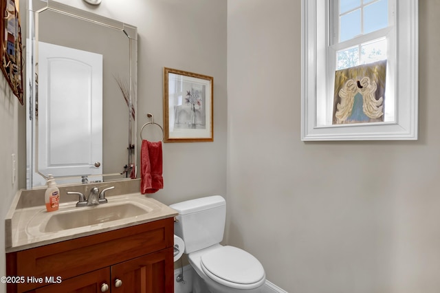 bathroom featuring toilet and vanity