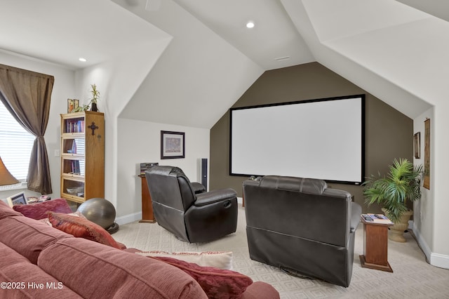 cinema with light colored carpet, baseboards, and lofted ceiling