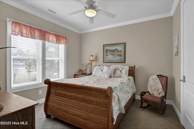 bedroom featuring visible vents, carpet, baseboards, ornamental molding, and a ceiling fan