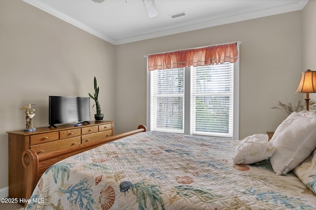 bedroom featuring visible vents, ceiling fan, and ornamental molding