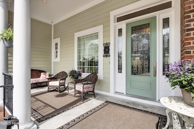 doorway to property with a porch