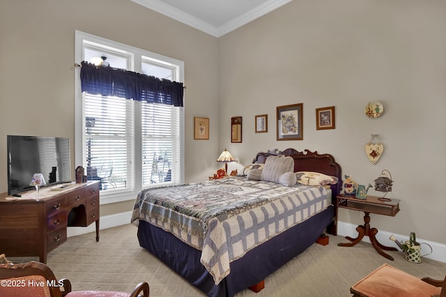 bedroom with baseboards, light carpet, and ornamental molding