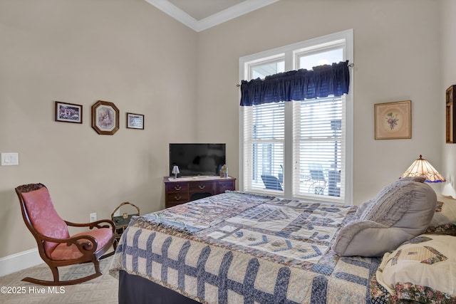 bedroom with baseboards and ornamental molding