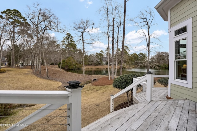 wooden deck featuring a water view