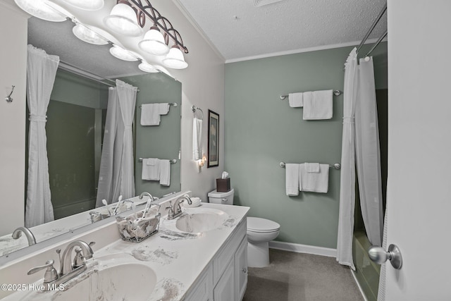 full bathroom featuring a textured ceiling, ornamental molding, toilet, and a sink