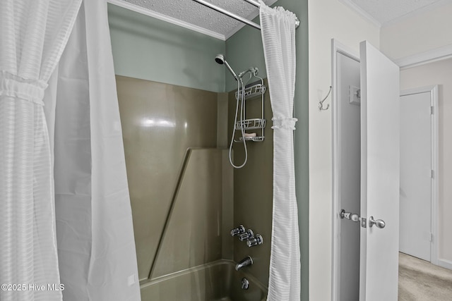 full bathroom with ornamental molding, shower / bathtub combination with curtain, and a textured ceiling