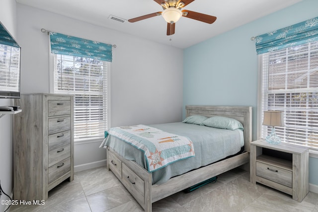bedroom featuring visible vents, baseboards, and ceiling fan