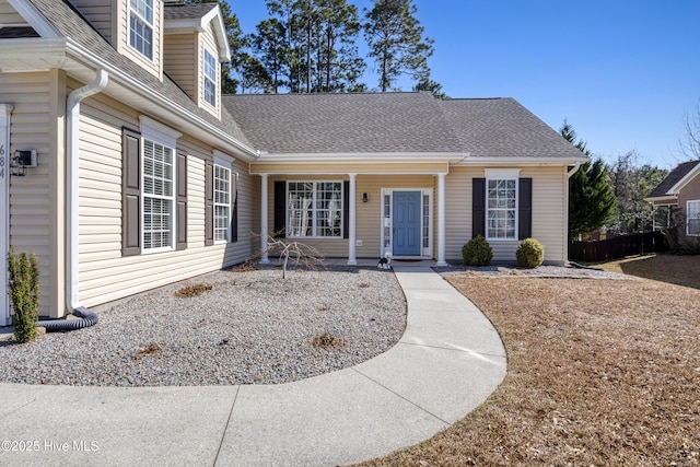 entrance to property with a shingled roof