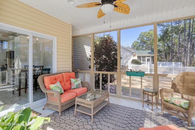 sunroom with a ceiling fan