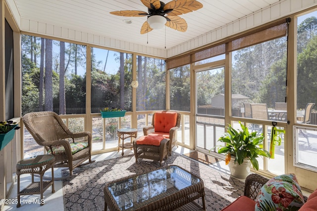 sunroom / solarium with plenty of natural light and ceiling fan