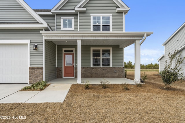 craftsman-style house with brick siding, covered porch, and an attached garage