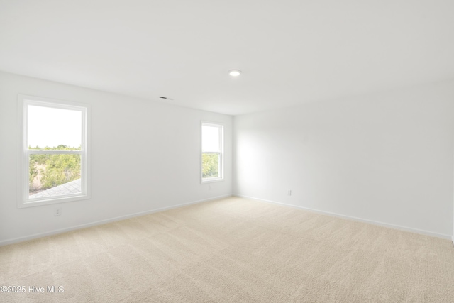 empty room with recessed lighting, baseboards, and carpet floors