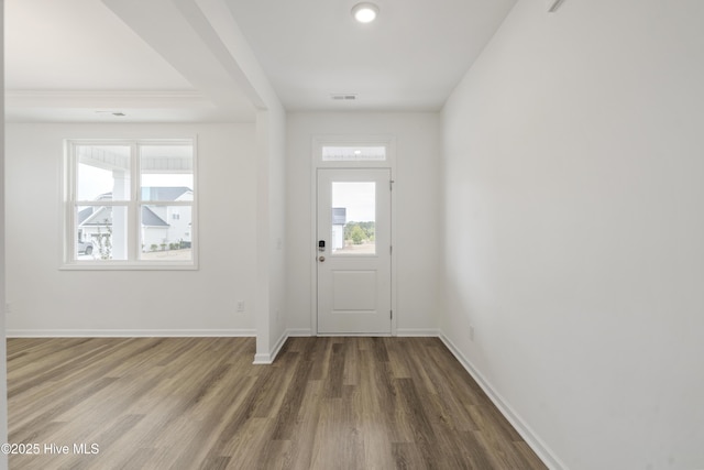 entrance foyer featuring recessed lighting, visible vents, baseboards, and wood finished floors