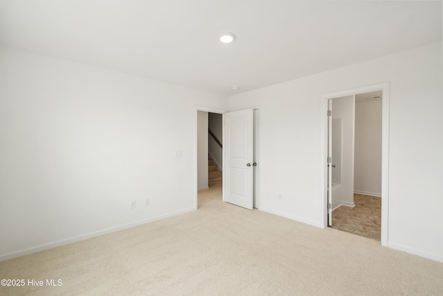 unfurnished bedroom with baseboards and carpet floors