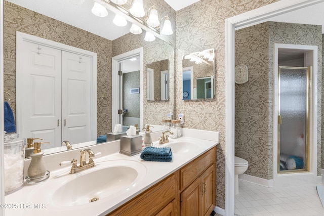 full bathroom with wallpapered walls and a sink