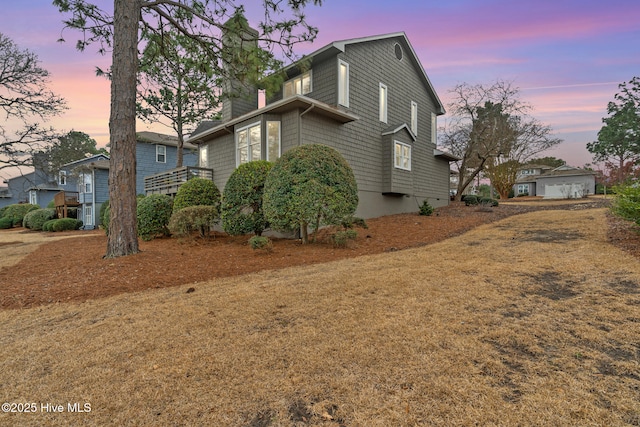 view of front of property with crawl space and a chimney