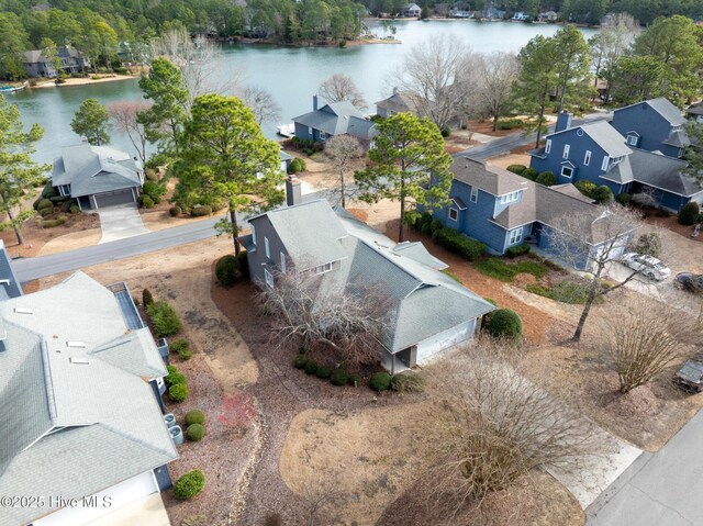 birds eye view of property featuring a residential view and a water view