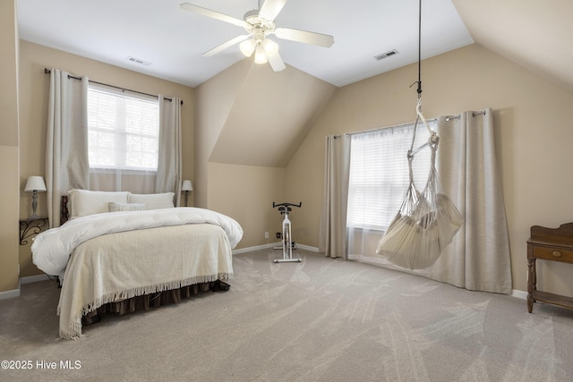 bedroom with visible vents, multiple windows, lofted ceiling, and carpet floors