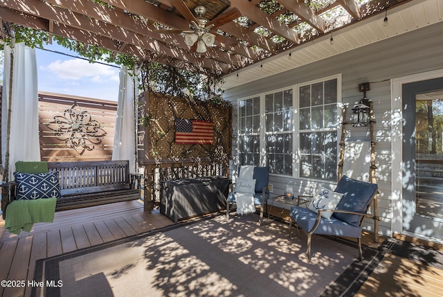 view of patio / terrace featuring a ceiling fan and a pergola