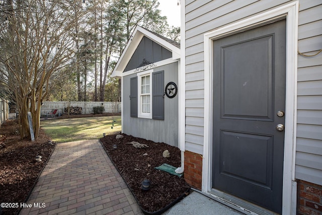 doorway to property with fence