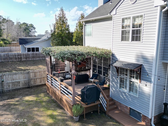 exterior space featuring fence private yard and a deck