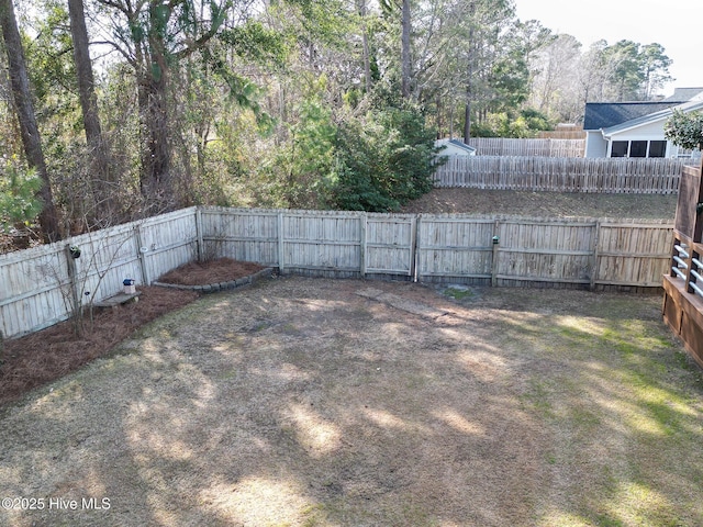 view of yard with a fenced backyard