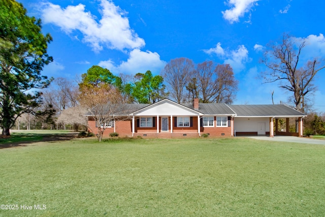 ranch-style house with brick siding, a front lawn, concrete driveway, a chimney, and a carport