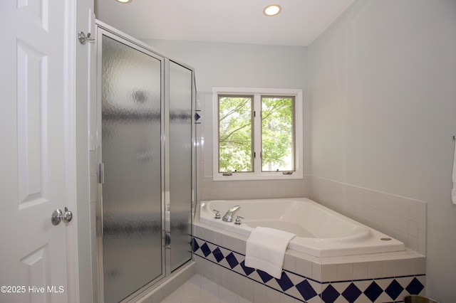 full bath featuring a shower stall, a bath, recessed lighting, and tile patterned floors