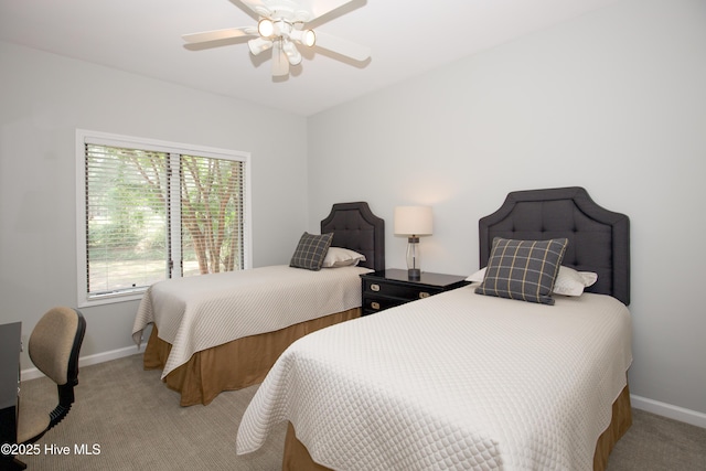 bedroom with baseboards, carpet, and a ceiling fan