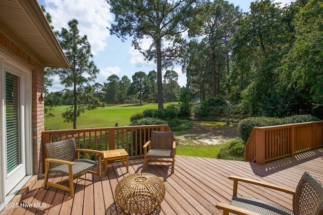 wooden deck featuring a yard