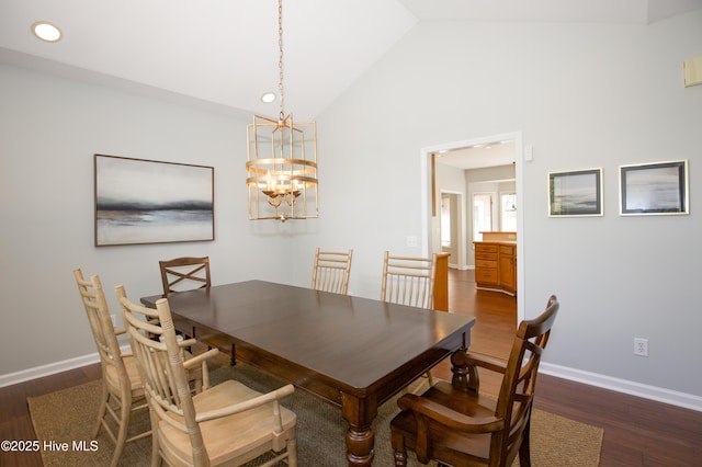 dining space with recessed lighting, baseboards, dark wood-type flooring, and an inviting chandelier